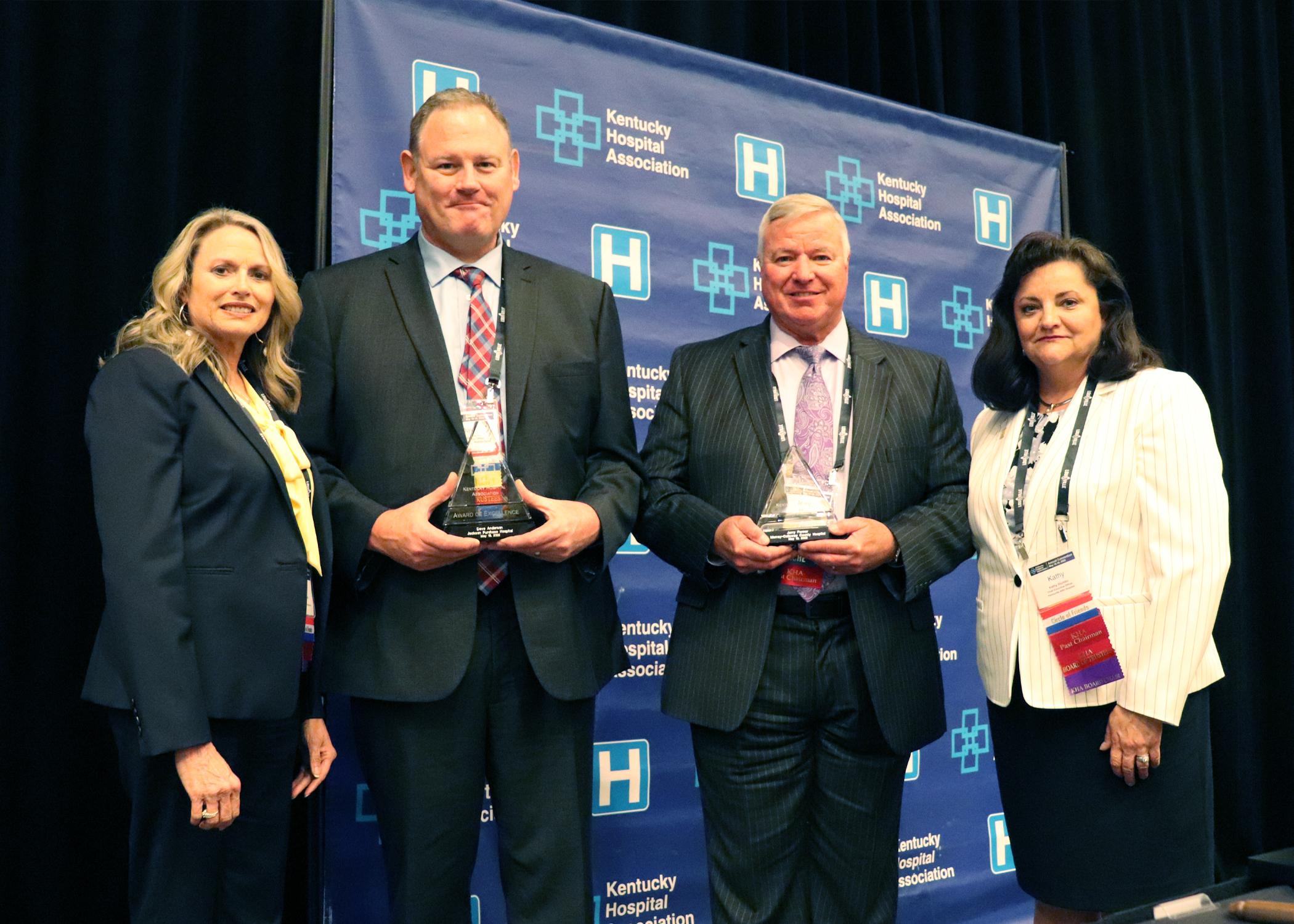 Anderson and Penner accept the KHA Award of Excellence